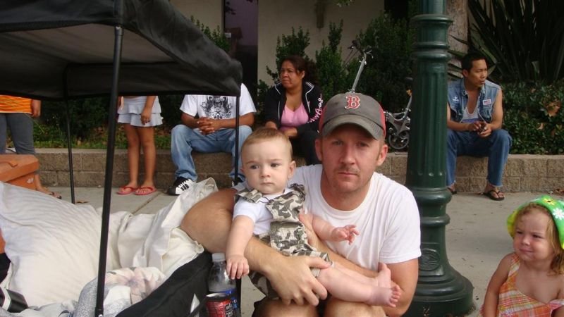 Trey and Daddy - Serious Faces at the Parade